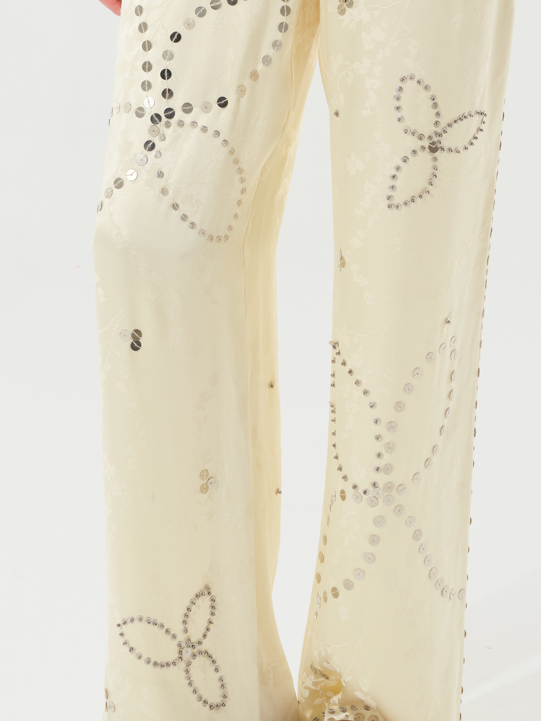 BRITY - Satin pants with metal stud detailing